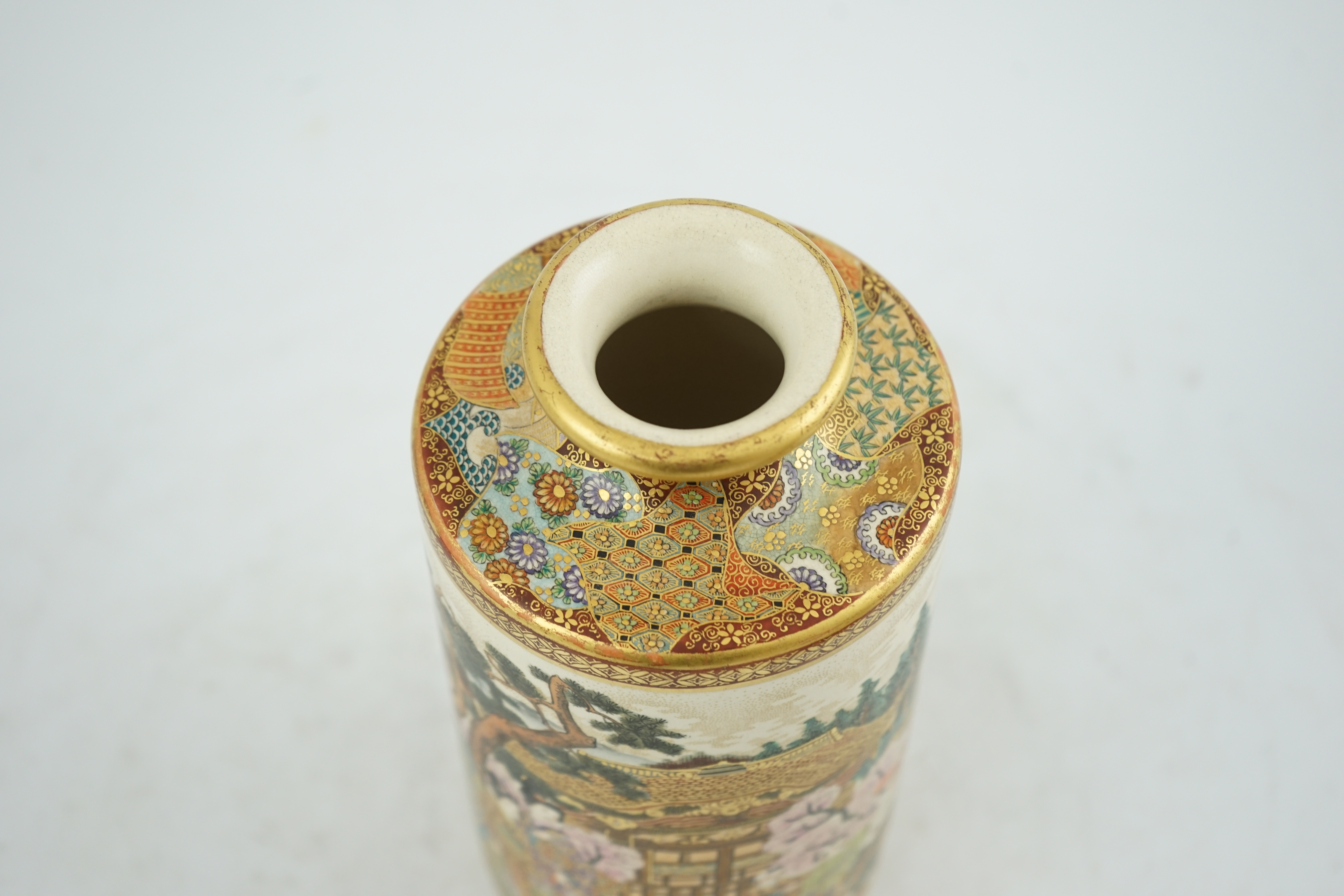A Japanese Satsuma ‘Spring festival’ cylindrical vase, Meiji period